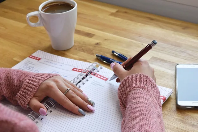 writing, notebook, planning, handwritten, coffee, pen, work, table, mobile phone, hand, office, study, writing pad, manicure, relaxation, page, wooden table, beautiful ring, calm, organizer, ai generated. Accounting buyer personas built from tasks, records and deadlines rather than stereotypes
